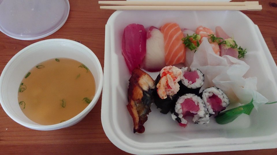Sushi plates arranged on a clean table.